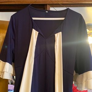 Mid size dress down to the knee size large used but in great condition